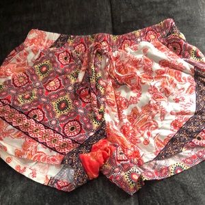 Pink and white shorts with blue &  yellow patterns